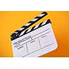 video production movie clapper cinema action and cut concept isolated on yellow background