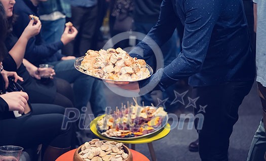new year and christmas office party close up details food preparing and eating drinks and gifts authentic local startup business team new year and christmas office party close up details food preparing and eating drinks and gifts authentic local startup business team