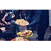 new year and christmas office party close up details food preparing and eating drinks and gifts authentic local startup business team