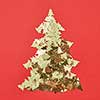 New Year decorative tree handmade from shiny small spruces on a red background, copy space. Greeting holiday card.