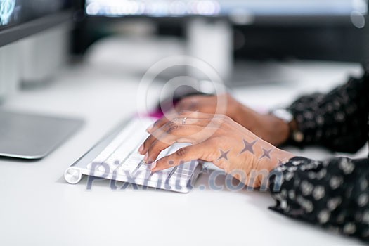 young afro american modern muslim business woman wearing scarf on creative bright office workplace with big screen young afro american modern muslim business woman wearing scarf on creative bright office workplace with big screen