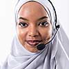 African muslim female with hijab scarf customer representative business woman with phone headset helping and supporting online with customer in modern bright call centre isolated on white background