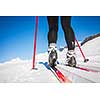 Cross-country skiing: young woman cross-country skiing on a winter day (motion blurred image)