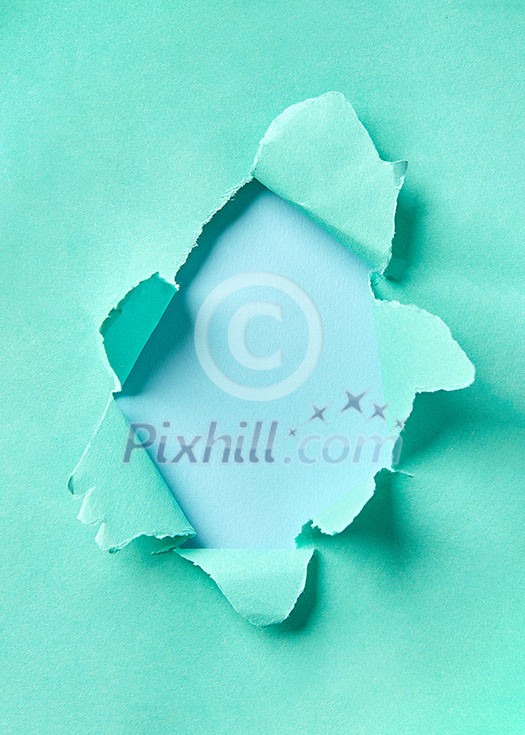 Creative handmade frame from torn turquoise paper on a pastel blue background with copy space. Can be used for your creativity. Creative handmade frame from torn turquoise paper on a pastel blue background with copy space. Can be used for your creativity.