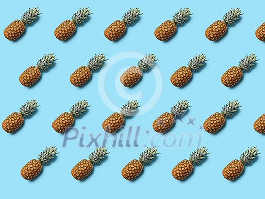 Exotic fruit pineapple with leaves on a blue background as layout for your ideas. Flat lay Exotic fruit pineapple with leaves on a blue background as layout for your ideas. Flat lay
