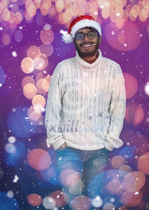 Indian man wearing traditional Santa Claus hat and white sweater on chalkboard background studio dark-skinned Christmas santa new year party Indian man wearing traditional Santa Claus hat and white sweater on chalkboard background studio dark-skinned Christmas santa new year party