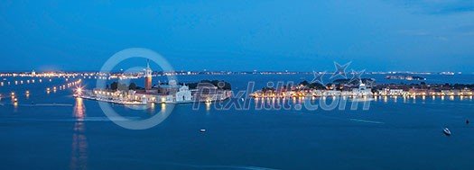 Venice - San Giorgio church - night. Panoramic view of traditional old Gondola on Canal Grande with historic San Giorgio Maggiore church on background in Venice, Italy.