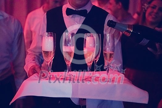 new year office party celebration event Man pours champagne drink in wineglasses new year office party celebration event Man pours champagne drink in wineglasses
