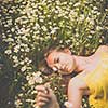 Portrait of young  woman with radiant clean outdoor on a spring/summer sunny day