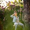Pretty, young woman with headphones outdoors, in a lovely park, enjoyig the hi-fi quality sound, listening to her favorite songs (color toned image)