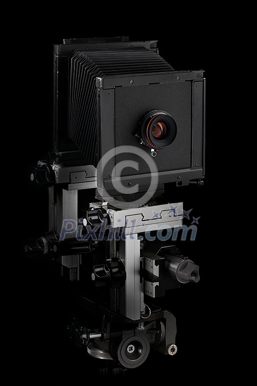 Vintage retro old-fashioned photo camera on a black background with copy space. Vintage retro old-fashioned photo camera on a black background with copy space.