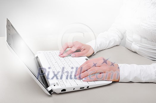 Close up of man's hands using laptop and splashes out of monitor Close up of man's hands using laptop and splashes out of monitor