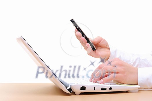 Close up of man's hands using laptop and splashes out of monitor Close up of man's hands using laptop and splashes out of monitor