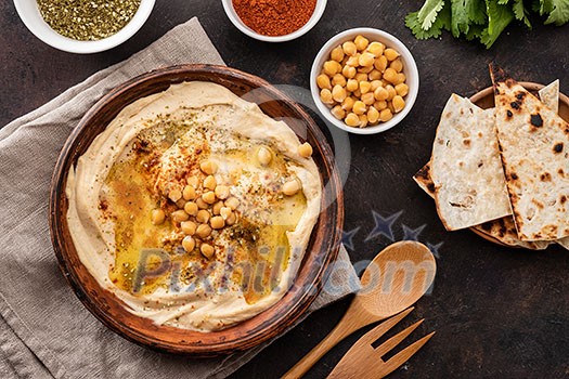 Classic Hummus with chickpeas, paprika, olive oil and oriental spices. Mediterranean popular snack of chickpeas and tahini pasta. Classic Hummus with chickpeas, paprika, olive oil and oriental spices. Mediterranean popular snack of chickpeas and tahini pasta.