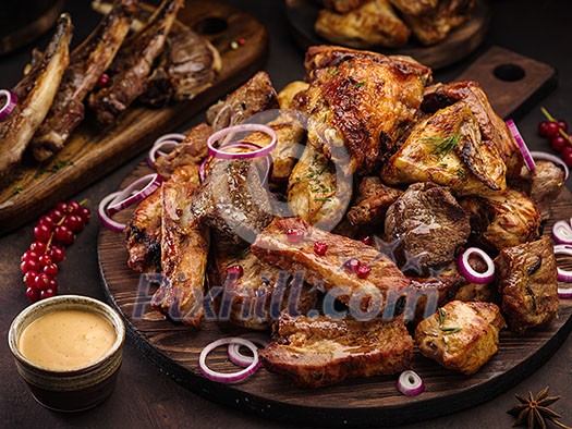 Grilled assorted meat with sauce and pomegranate Grilled assorted meat with sauce and pomegranate