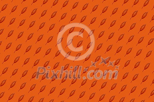 Decorative backdrop handmade from organic colored fall leaves on an orange background. Flat lay. Decorative backdrop handmade from organic colored fall leaves on an orange background. Flat lay.