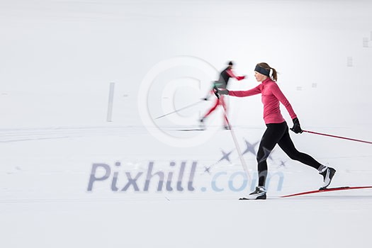 Cross-country skiing: young woman cross-country skiing on a winter day (motion blurred image) Cross-country skiing: young woman cross-country skiing on a winter day (motion blurred image)