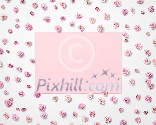 Greeting photo frame from blossoming small flowers and pastel pink rectangular place for text. Flat lay. Valentine's Day concept. Greeting photo frame from blossoming small flowers and pastel pink rectangular place for text. Flat lay. Valentine's Day concept.