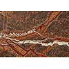 Brown granite surface of graphic abstract textured stone pattern background, copy space. Natural background for interior decoration.