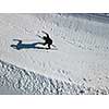 Cross-country skiing: young man cross-country skiing on a winter day (motion blurred image) - aerial image