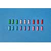 Colorful clothespegs made of two rows on a blue background with soft shadows and copy space. Flat lay.