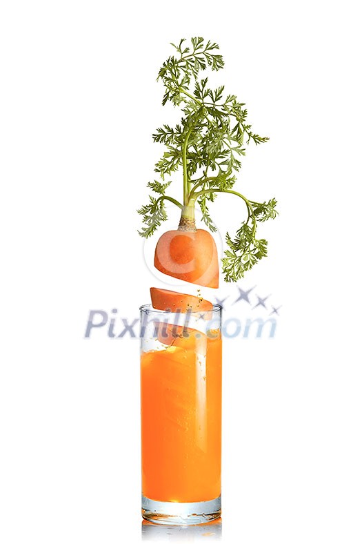 Organic natural fresh carrot root with green leaf in the glass of juice on a white background, copy space. Vegetarian concept. Organic natural fresh carrot root with green leaf in the glass of juice on a white background, copy space. Vegetarian concept.