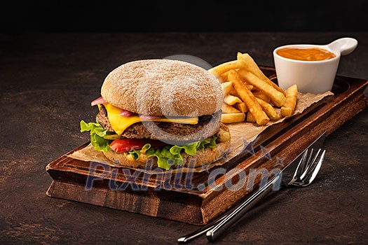 Delicious fresh homemade cheeseburger with marinated onions and red pepper. Beef Burger with Cheese and Vegetables Delicious fresh homemade cheeseburger with marinated onions and red pepper. Beef Burger with Cheese and Vegetables