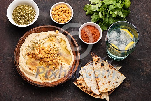 Classic Hummus with chickpeas, paprika, olive oil and oriental spices. Mediterranean popular snack of chickpeas and tahini pasta. Classic Hummus with chickpeas, paprika, olive oil and oriental spices. Mediterranean popular snack of chickpeas and tahini pasta.