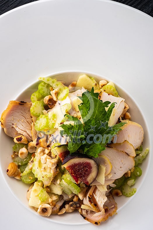 Grilled chicken breast salad with figs, green apple, celery, nuts and Parmesan Grilled chicken breast salad with figs, green apple, celery, nuts and Parmesan