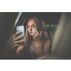 Cute teenage girl in a car, enjoying the ride