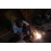 welder with protective mask welding steel structures and bright sparks in construction industry