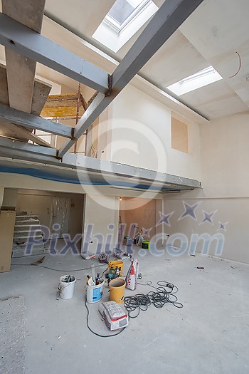 interior of construction site with scaffolding in a large modern unfinished duplex apartment interior of construction site with scaffolding in a large modern unfinished duplex apartment