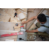 work in progress on stylish interior professional carpenter installing wooden stairs in big modern two level luxury apartment