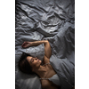 Pretty, young woman in her bed, fast asleep. Importance of sleep concept