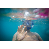 Young man having fun and taking underwater selfie while swimming in the sea