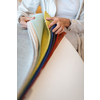 Pretty young woman  choosing the right material/color for her modern appartement interior (shallow DOF; color toned image)
