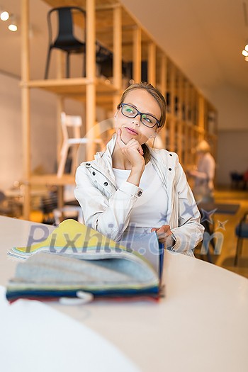 Pretty young woman choosing the right material/color for her modern appartement interior (shallow DOF; color toned image) Pretty young woman choosing the right material/color for her modern appartement interior (shallow DOF; color toned image)