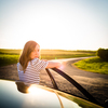 Pretty, young woman driving her car
