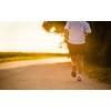 Male athlete/runner running on road - jog workout well-being concept