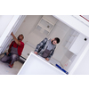 two professional workers installing a new stylish modern kitchen furniture