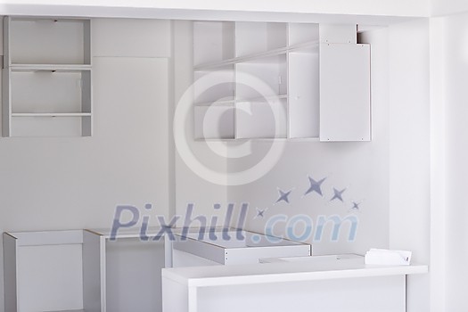 work in progress on the beautiful modern bright clean unfinished kitchen interior in new luxury home with wooden cupboards work in progress on the beautiful modern bright clean unfinished kitchen interior in new luxury home with wooden cupboards