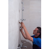 professional plumber working in a bathroom, plumbing repair service, assemble and install concept  plumber tools and equipment in a bathroom