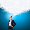 Funny young businesswoman with big head wearing glasses 