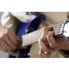 Close up of male hands playing electric guitar