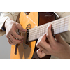 Close up of male hands playing acoustic guitar