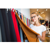 Pretty young woman  choosing the right material/color for her modern appartement interior (shallow DOF; color toned image)