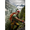 Young, male climber on a via ferrata route - climbing on a rock in Swiss Alps