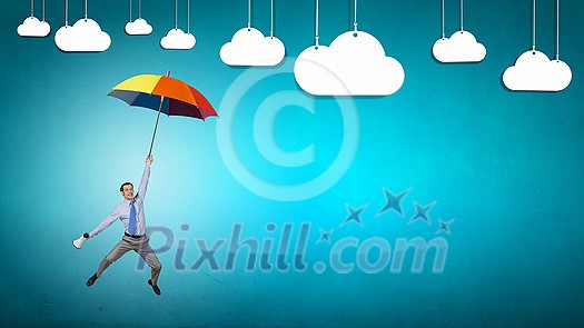 Young businessman flying high in sky on umbrella Young businessman flying high in sky on umbrella