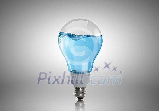 Energy and ecology concept with light bulb with water inside Energy and ecology concept with light bulb with water inside