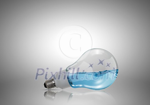 Energy and ecology concept with light bulb with water inside Energy and ecology concept with light bulb with water inside